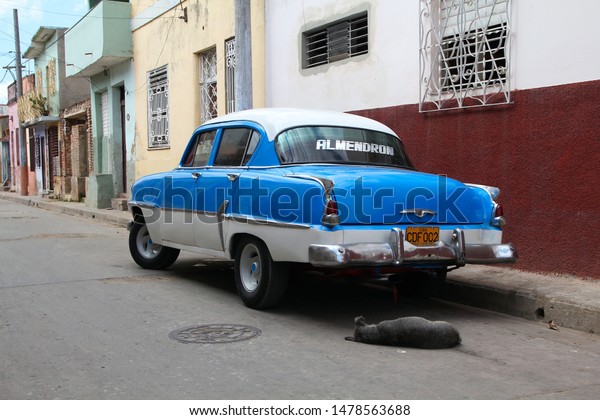 CAMAGUEY, CUBA - FEBRUARY 18, 2011: Vintage car\
parked in Camaguey, Cuba. Cuba has one of the lowest car-per-capita\
rates (42 per 1000 people in\
2015).