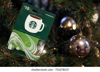 Camberley, UK - 31 Dec 2016: British Starbucks £10 Gift Card Or Voucher, Nestled Among The Branches Of A Christmas Tree