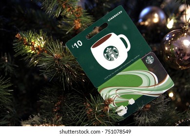 Camberley, UK - 31 Dec 2016: British Starbucks £10 Gift Card Or Voucher, Nestled Among The Branches Of A Christmas Tree