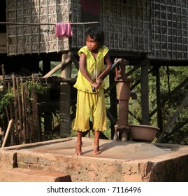 Cambodian Girl Pumping Water Into Basin Stock Photo (Edit Now) 7116496