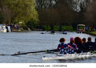 CAMBRIDGE, CAMBRIDGESHIRE, ENGLAND, UK - MARCH 09, 2019: Cambridge University College Boat Clubs take part in the Lent Bumps rowing competition on the River Cam.