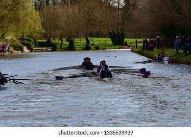 CAMBRIDGE, CAMBRIDGESHIRE, ENGLAND, UK - MARCH 09, 2019: Cambridge University College Boat Clubs take part in the Lent Bumps rowing competition on the River Cam.