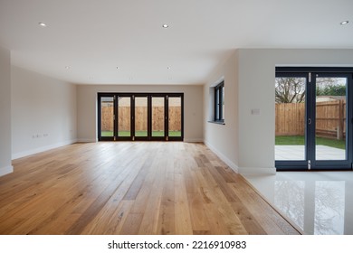 Cambridge, England - March 29 2018: Modern Stylish Unoccupied Room Within Brand New Home With Bifold Patio Doors