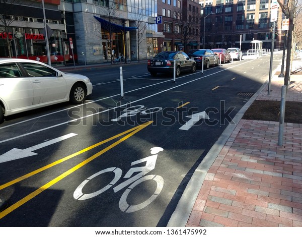 Cambridge, MA - March 16 2019: The two-way\
protected bike lane on Ames\
Street