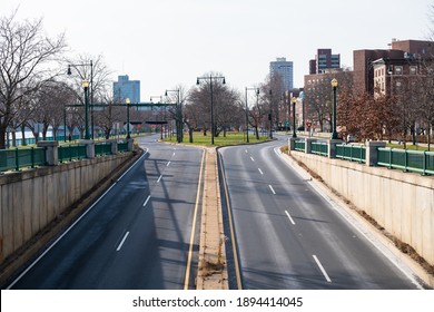 CAMBRIDGE, MASSACHUSETTS - DECEMBER 11, 2020: Empty Memorial Drive roadways along the Charles River in Boston, MA.