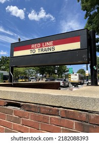 CAMBRIDGE, MASSACHUSETTS - JULY 23, 2022: The Massachusetts Bay Transportation Authority MBTA Sign RED LINE TO TRAINS At Entrance.