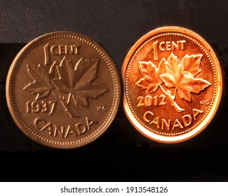 Cambridge, Ontario, Canada -  February 9 2021 : Showing A Canadian 2012 One Cent Coin Beside A Canadian 1937 Penny.