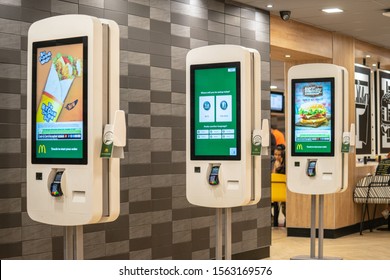Cambridge, UK, August 1, 2019. McDonald's Restaurant Digital Menu Boards Self-serve Kiosks With Touch Screen