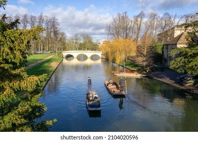 Cambridge, UK - January 7 2022: Punting on the River Cam by the Clare Bridge, Cambridge, England