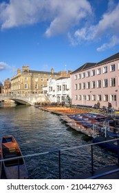 Cambridge, UK - January 7 2022: Punting on the River Cam at Magdalene Bridge, Cambridge, England