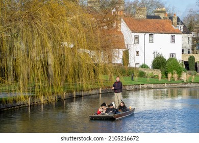 Cambridge, UK - January 7 2022: Tourist punting trips on the River Cam in Cambridge, England