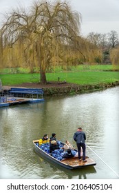 Cambridge, UK - January 7 2022: Punting trip at Mill Pond, Cambridge