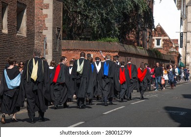 Cambridge, UK - May 16, 2015: Colleagues Graduation Day Of Students From University Of Cambridge. University Students In Gown Are Walking On The Street Going Back To Their Colleges.