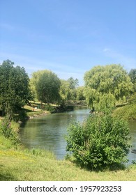 Cambridge, United Kingdom - June 28, 2019: Gardens and lake in the Science Park in Cambridge. High quality photo