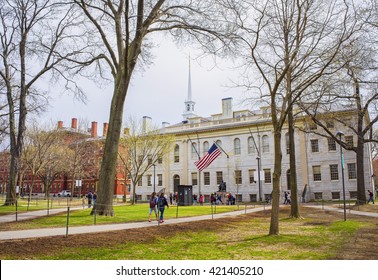 Cambridge, USA - April 29, 2015: University Hall and John Harvard Monument in the campus of Harvard University, Massachusetts, MA. It is well-known statue of Harvard University founder in America.