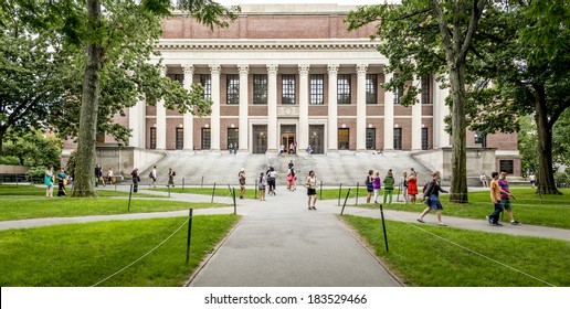 CAMBRIDGE, USA - JULY 12: View Of The Campus Of The Famous Harvard University In Cambridge, Massachusetts, USA With Some Students, Locals, And Tourists Passing By On July 12, 2013.