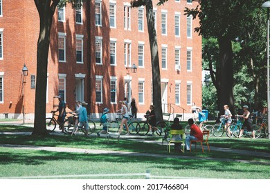 CAMBRIDGE, USA - JULY 14: View Of The Campus Of The Famous Harvard University In Cambridge, Massachusetts, USA With Some Students, Locals, And Tourists Passing By On July 14, 2019.