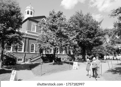 CAMBRIDGE, USA - JUNE 9, 2013: People visit Harvard University campus in Cambridge, MA. Harvard was established in 1636. Its annual endowment is 36.4 billion USD.
