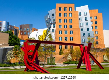 CAMBRIDGE,MA-APR 29: Red metal sculpture by artist Mark di Suvero and the iconic Stata Center by architect Frank Gehry on the MIT campus in Cambridge on Apr. 29, 2012. Both are giants in their fields.