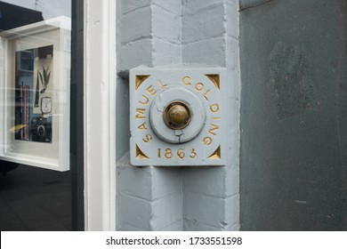 Cambridgeshire, UK - Circa May 2020: Very Old Brass Door Bell Seen Renovated To A Fine Condition. Located Outside A Retail Shop, Once A Private Dwelling For The Brass Door Bell.