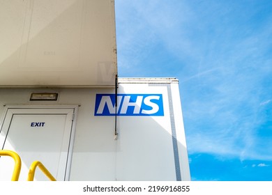 Cambridgeshire, UK - Circa September 2022: Abstract View Of A British Health Service Logo Seen On A Mobile Cancer Screening Unit Trailer. Patients Exit This Door Once The Screening Has Taken Place.