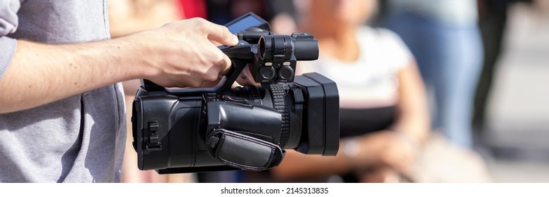 Camcorder Recording Outdoors. Electronic News Gathering.