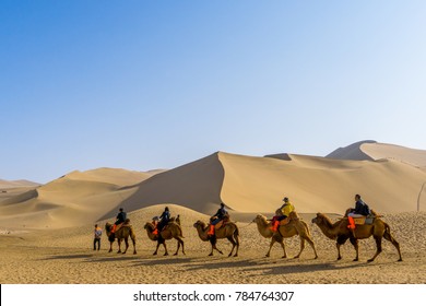 Camel caravan at Gobi desert. This is a famous place part of silk road in Dunhuang, Gansu, China. - Shutterstock ID 784764307