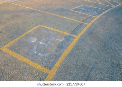 Camelback Mountain, Phoenix, Arizona- Parking Lot Sign For Disabled On A Concrete Pavement. Parking Slot For PWD's With Painted Yellow Line And White Symbols.