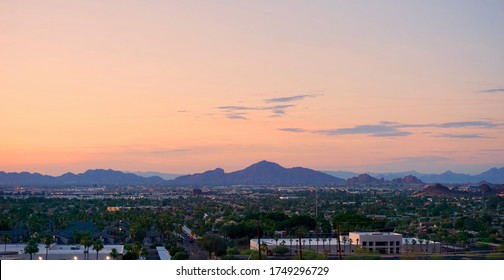 Camelback Mountain Skyline At Sunset With Orange Toned Sky.