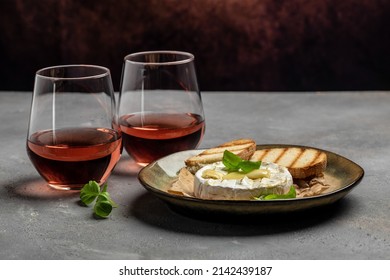 camembert cheese baked with with basil leaves and wine. banner, menu, recipe place for text, top view.