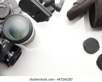 camera accessory put on white background with copy space. cameras and camera lens top view.