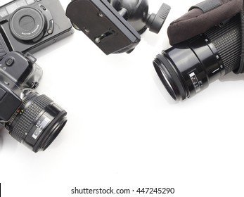 camera accessory put on white background with copy space. cameras and camera lens top view.