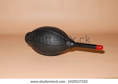 Camera and computer lens cleaning equipment, black air blower with red tip for blowing dust