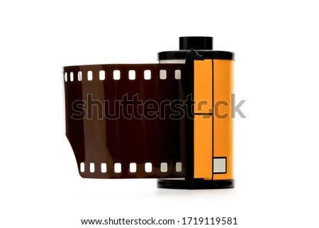 Camera film roll cartridge or 35mm filmstrip.equipment for photograph on white background.

