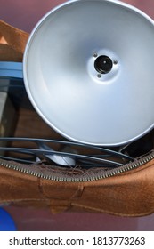 Camera Flash Bulb And Film Equipment In A Camera Bag