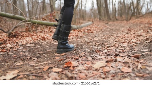 Camera Following Woman Legs While Walking In Forest Slow Motion Footage