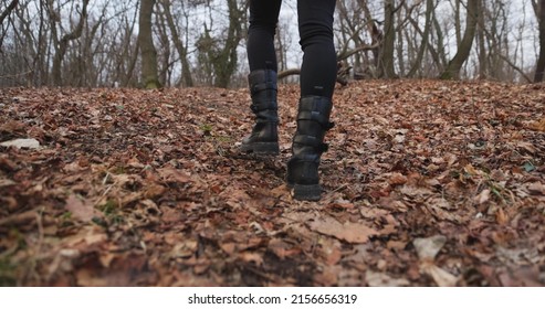 Camera Following Woman Legs While Walking In Forest Slow Motion Footage