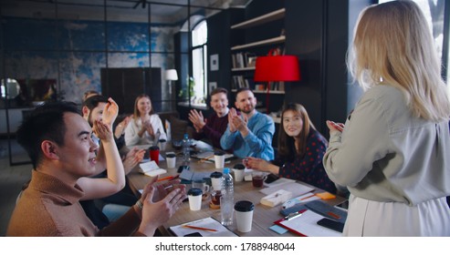 Camera Follows Successful Happy Young Blonde Female Boss Entering Office Meeting Applaused And Cheered By Employees.