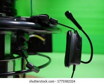 Camera Headphone Broadcast Television Studio Camera With Greenscreen At TV Station.