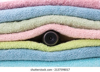 Camera Hidden Between Folded Towels, Closeup View