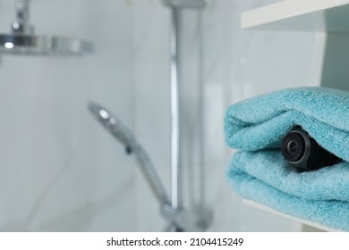 Camera Hidden Between Towels In Bathroom, Space For Text