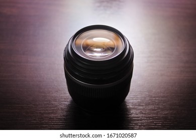 Camera lens aperture with reflections. Backlight with selective focus.