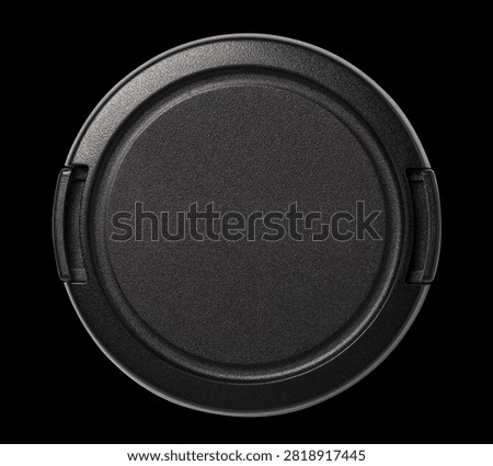 Camera lens cap, isolated on black background