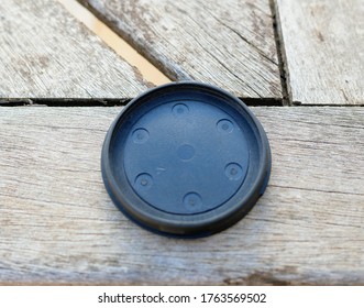 a camera lens cap on a table