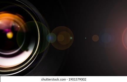 Camera lens with lense reflections.Camera lens detail, front glass of wide angle photography DSLR camera lens, macro shot, selective focus.