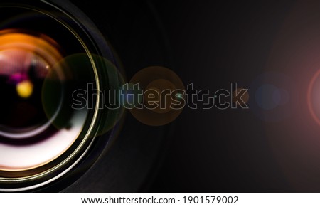 Camera lens with lense reflections.Camera lens detail, front glass of wide angle photography DSLR camera lens, macro shot, selective focus.
