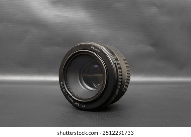 Camera Lens on black gray background - 50 mm prime lens - Dslr camera lens