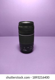 Camera lens on a pruple background
