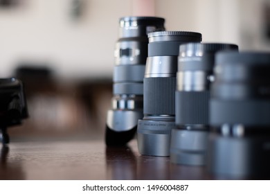 Camera Lenses Lined Up on a table