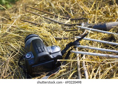 the camera is lying on a haystack